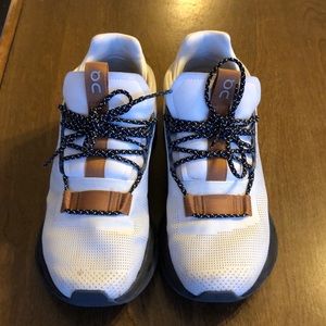 Cloud nova white running shoes.